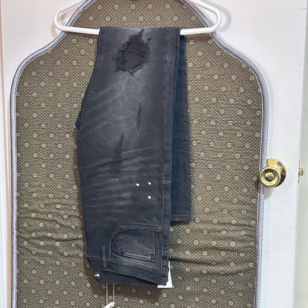 New purple jeans size 32 with knee cut. Very nice never worn from saks fifth